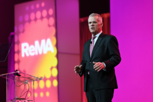 man presenting on a stage