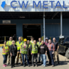 group standing in front of recycling company