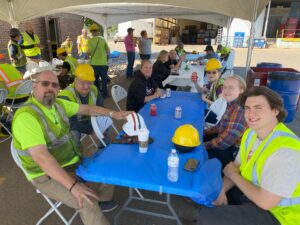 group of people sitting together around a table